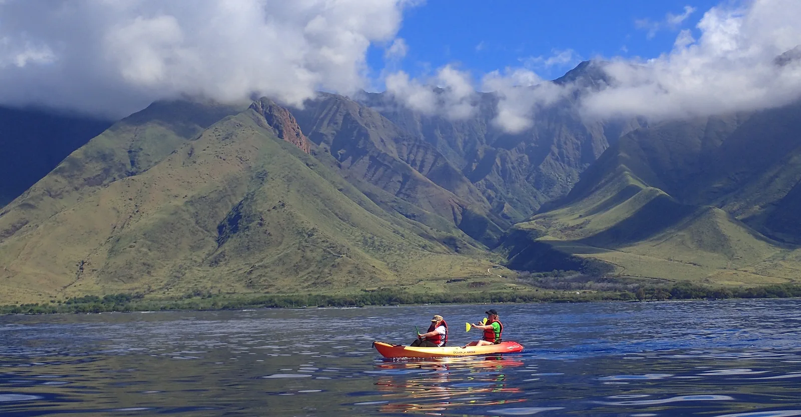 A guest kayaking the calm coral gardens at Olowalu on the west side of Maui